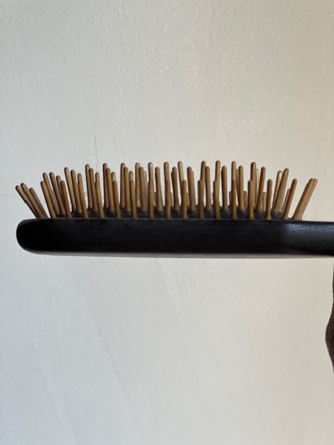 dog brush with wooden pins that cuts down on static in the coat